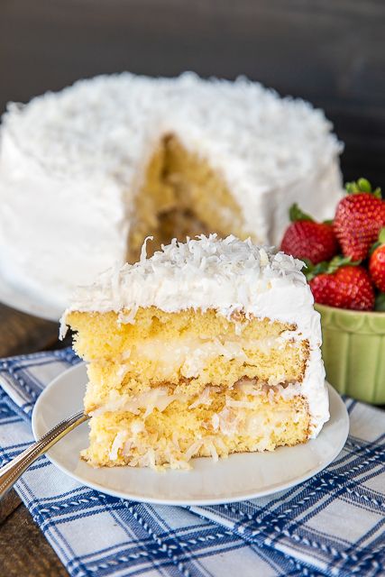 Coconut Cake - the sour cream cool whip frosting makes this cake! It is AMAZING!!! So easy to make and everyone loves it! This is my go-to cake for holidays and parties. Everyone always asks for the recipe! Only 5 ingredients -Cake mix, sour cream, cool whip, coconut and sugar. The frosting has to sit overnight in the refrigerator, so plan ahead to make this easy Coconut Cake! #cake #coconutcake #dessert #recipe Icing With Cool Whip, Coconut Cake Icing, Cool Whip Icing, Coconut Cake Frosting, Whip Icing, Cake Recipe With Sour Cream, Sour Cream Coconut Cake, Sour Cream Icing, Cake With Sour Cream