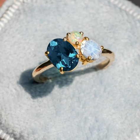 "Toi Et Moi Ring/Multi Stone Ring/Topaz Opal Moonstone Ring/London Blue Ring/Moonstone & Opal Ring/Three Stone Ring/Cluster Engagement Ring ★ ★ ★ ★  CUSTOM/DUTY-FREE SHIPPING WORLDWIDE, BUYERS DON'T HAVE TO PAY ANY CUSTOM FEES WHILE IMPORTING ★ ★ ★ ★  Details Made to order Material: 14k/18k Gold Color Options: Yellow Gold, White Gold, Rose Gold ★ Stone 1 London Blue Topaz, Oval Cut Size: 6x8mm Approx Weight (Ct): 1.29 ★ Stone 2 Moonstone, Round Size: 5mm  Approx Weight (Ct): 0.585 ★ Stone 3 Opal, Round Size: 3mm  Approx Weight (Ct): 0.14 ★ 100% Natural Diamond and Gemstones ★ Diamond: Round Brilliant cut, G-H Color, SI Clarity ☂ Shipped with Insured Shipping with 4-7 business days. ➦ 100% Free Returns. ➦ Our Jewelry comes with a Lifetime Warranty. (Stone Replacement not included) ✈ We offe Cluster Stone Ring, Opal Stone Ring, Opal Moonstone, Ring Three Stone, Ring Cluster, Ring Moonstone, Blue Ring, Topaz Jewelry, Three Stone Ring