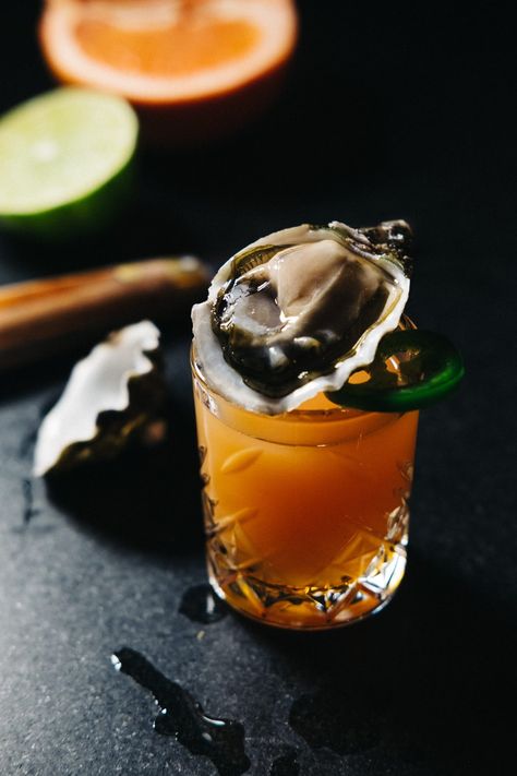 A summery oyster shooter that has it all: citrus, heat, ... Oyster Shooters Recipe, Oyster Shots Recipes, Oyster Shooter Recipe, Oyster Shots, Oyster Shooter, Gastronomic Food, Healthy Cocktail Recipes, Edible Cocktails, Shooter Recipes