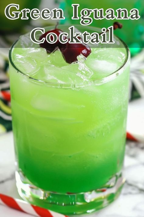 The Green Iguana Cocktail is a tropical drink that combines the refreshing flavors of pineapple and orange juice with the creamy richness of coconut. Mixed with coconut rum, vodka, and a splash of blue curacao, this cocktail is vibrant and perfect for a summer day or a fun gathering. Cocktails With Blue Curacao, Blue Curacao Drinks, Green Cocktails, Green Punch, Green Iguana, Beach Drinks, Rum Punch, Mixed Drinks Recipes, Cocktail Recipes Easy