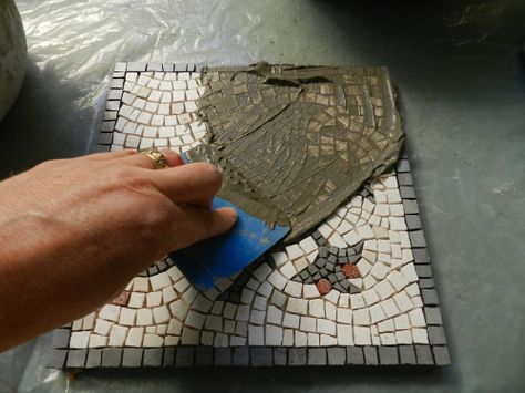 http://blog.mosaicartsupply.com/how-to-fix-grout-mistakes/ NB Vinegar removes tiles from mosaic Diy Mosaic Floor, Grouting Mosaics, Mosaic Techniques, Mosaic Trivet, Mosaics Art, Floor Grout, Mosaic Art Diy, Mosaic Stepping Stones, Mosaic Pots