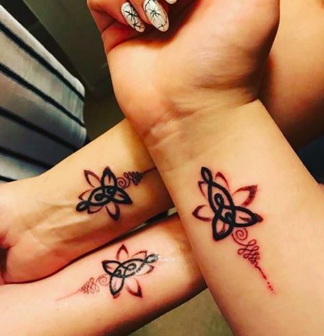 CafeMom.com : Signs & Symbols : 50 Mother-Daughter Tattoos That Celebrate an Unbreakable Bond -- Nothing bonds a mother to her daughters quite like a meaningful tattoo, especially one that looks culturally and spiritually significant. More from CafeMom: 50 Gorgeous Finger Tattoos That Deserve a Thumbs Up Mother Daughter Infinity Tattoos, Mother Tattoos For Children, Henne Tattoo, Mother Son Tattoos, Mom Daughter Tattoos, Tato Dengan Makna, Tiny Heart Tattoos, Tattoo For Son, Inspiration Tattoos