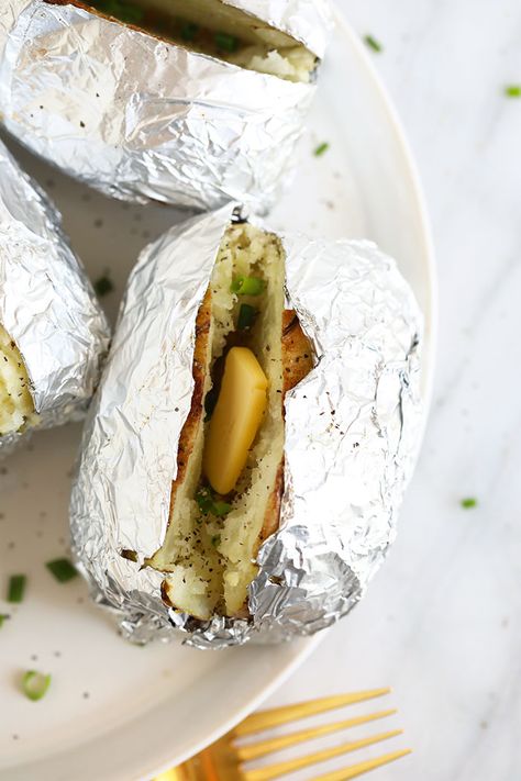 One of our fav sides is a baked potato in foil. Whether you want to make a grilled baked potato in foil or oven baked potatoes in foil, we'll teach you how to make both! How To Bake Potatoes In Oven In Foil, Baked Potatoes In Oven With Foil, Baking Potatoes In Oven With Foil, Best Baked Potatoes In The Oven In Foil, Foil Baked Potatoes Oven, Baked Potatoes In Foil In The Oven, Foil Wrapped Baked Potatoes In The Oven, Oven Baked Potato In Foil, Baked Potatoes On The Grill In Foil