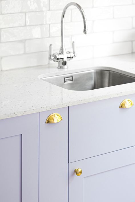 There's a definite trend towards adding colour to a kitchen   This beautiful lilac kitchen in our Bloomsbury project shows how colour doesn't need to be scary   The draw fronts are in a beautiful lacquered pale lilac, with gold handles and drawer pulls, a soft grey composite worktop and hand glazed high gloss rectangular tiles for the backsplash   For more design details and tips see our website Lilac Kitchen, Lavender Kitchen, Rectangular Tiles, Hallway Paint, Joinery Design, London Interior, Pale Lilac, Home Automation System, Grey Kitchen Cabinets