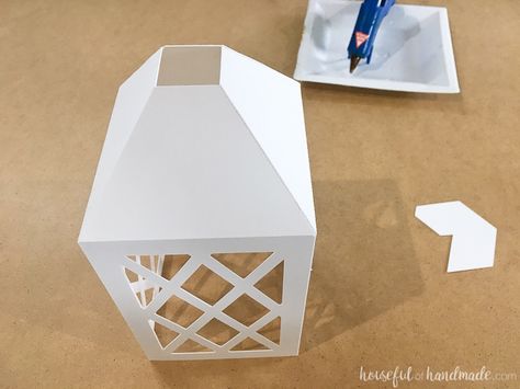 Make beautiful paper lanterns with these digital cut files. These paper lanterns decor are easy to make and no one will guess you made them out of paper! How to Make DIY Paper Lanterns Decor | Housefulofhandmade.com | #Papercrafts #Silhouette #cricut #DIYDecor #Budgetdecor Paper Lanterns Decor, Candle Silhouette, Diy Paper Lanterns, Christmas Lights Inside, Lantern Template, Paper Lantern Decor, Paper Lanterns Diy, Silhouette Cameo Crafts, Paper House