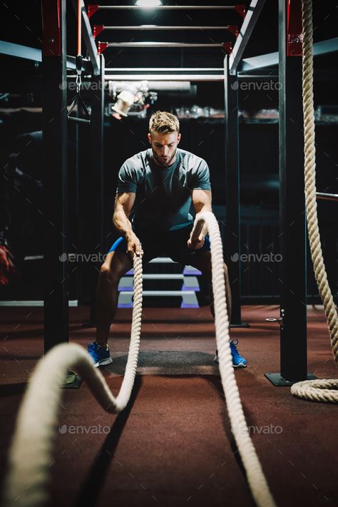 Fit man working out with battle ropes at fitness gym by nd3000. Happy fit man working out with battle ropes at fitness gym #Sponsored #battle, #ropes, #working, #Fit Beginner Gym Workout Routine, Workout Routines For Men, Gym Rope, Battle Rope Workout, Fitness Shoot Ideas, Manifest 2024, Gym Photography, Body Build, Gym Lifestyle