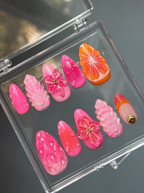 Hand painted gel press ons, made to order. Pink and orange tropical themed nails with 3D fruit and flowers.Medium almond shown in images. Each press on set comes with a set of application tools. I recommend ordering a sizing kit to know your nail size! Beach Aura Nails, Almond Seashell Nails, 3d Nail Art Fruit, Beach Orange Nails, Nails Theme Ideas, Nail 3d Art, Fruit Almond Nails, Pink Lemonade Nail Designs, Nail Art Press On