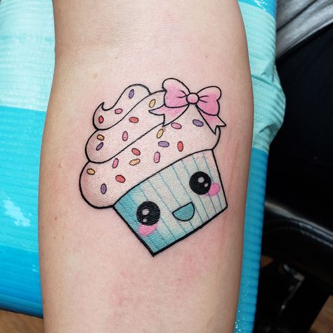 Cute little cupcake tattoo done by Doozer Soto #cupcaketattoo #cutetattoos #doozersototattoo #happylittlecupcake #sprinklescupcakes #iowatattoo #tagtheqc #quadcitiesiowa #midwesttattoo Cupcake Tattoo Designs Girly, Cute Cupcake Tattoo, Fine Line Cupcake Tattoo, Tiny Cupcake Tattoo, Sweets Tattoo Ideas, Muffin Tattoo, Cute Cupcake Drawing, Cupcake Tattoo Designs, Dessert Tattoo