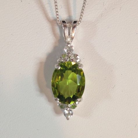 "Gorgeous Peridot & White Topaz Pendant Necklace * 2.5ct Oval Cut Peridot Doublet* Measures 10mm x 8mm * Brilliant Cut White Topaz Accents measure 2.25mm Round each * 3.5cts total gemstone weight * Sterling Silver ( also available in 14k Yellow Gold or 14kt White Gold - Message me for details) * 18\" Sterling Silver Chain Included Hallmarked & Gift Ready! Matching Cluster Ring also Available! TIMELESS, BEAUTIFUL & UNIQUE FINE ART JEWELRY! *The term doublet is used to describe any assembled piece Alexandrite Necklace, Trending Jewelry, Peridot Jewelry, Peridot Pendant, Chalcedony Ring, Peridot Necklace, Topaz Pendant, August Birthstone Jewelry, Solitaire Pendant Necklace