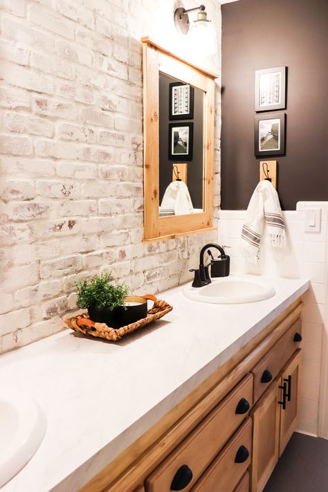 When we made over the boys bathroom, I knew I wanted a showstopper. Here's how to install and limewash brick veneer accent wall. Faux Brick Wall Bathroom Master Bath, Whitewash Brick Bathroom, Faux Brick Wall Bathroom Ideas, Faux Brick Bathroom Floor, Brick Tiled Bathrooms, Shiplap And Brick Bathroom, Faux Brick Wall In Bathroom, Bathroom With Brick Accent Wall, Painted Brick Bathroom Wall