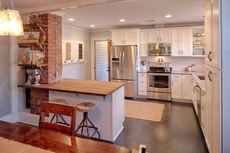 1107 Skidaway Rd, Savannah, GA 31404 | Zillow Wood Wall Design Ideas, Faux Brick Panels, Wall Design Ideas, Kitchen Peninsula, Wood Wall Design, Rustic Wood Wall, Brick Chimney, Brick Paneling, Brick Kitchen