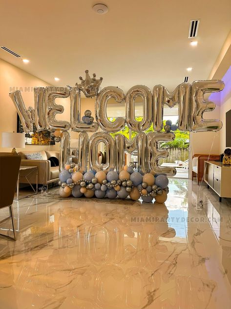 Balloon Sculptures: Welcome Home - Balloon Extravaganza "Where every helium-filled wonder whispers, Welcome Home!" Whimsical Creations by Miami Party Decor Its said that magic floats in the Miami air. But we believe its our balloons! At Miami Party Decor , weve been painting the skies of Sunny Isles, Key Biscayne, Miami Beach, and beyond with our legendary balloon sculptures. Paint Your Welcome in Colors! Imagine walking through a fairy-tale door, where colors dance in joy, celebrating your grand entrance. Our Welcome Home balloon sculpture promises just that, with radiant bouquets in shades of orange, blue, and the ever-elegant silver. And just like your preferences, they come in a medley - be it a lavish 13 bouquets, a subtle 4, or the balanced charm of 8. Turn The Dial to Your Style! Yo Welcome Home Balloons Ideas, Welcome Home Decorations Ideas Party, Welcome Home Balloons, Welcome Home Party Ideas, Welcome Home Decor, Welcome Home Party, Welcome Back Home, Welcome Home Decorations, Miami Party