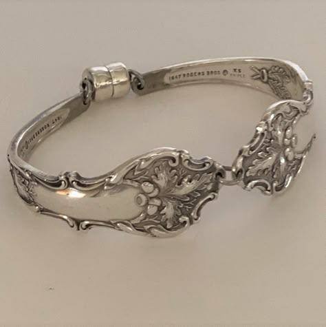 A beautiful handmade spoon bracelet created by recycling two matching antique silver plate spoons - the perfect gift for bridesmaids, weddings, for her or for mom.  Charter Oak is a pattern that was produced by 1847 Rogers in 1906, extremely collectible, and makes the perfect bracelet and a great addition to any woman's jewelry collection. **  The bracelet measures 3/4"at widest part.  The bracelet is elliptically shaped to provide proper movement and to not spin around on your wrist. **  To find your measurement:  wrap a piece of string or cloth tape around your wrist snug but not too tight, then add 1/2" to that measurement. If you need a different size please contact us and include your measurements.  Please visit our other listings at TheSilverYarn.Etsy.com All items are created in a s Vintage Spoon Jewelry, Silver Spoon Jewelry, Fork Bracelet, Spoon Bracelet, Gift For Bridesmaids, Gifts Bridesmaid, Silverware Jewelry, Spoon Jewelry, Handmade Bangles