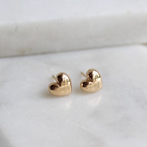 A beautiful pair of solid gold tiny heart stud earrings created by Lime Tree Design. The small size of these simple earrings means they are easy to wear both during the day and in the evening. The great advantage of solid gold is that it will not fade or tarnish and will remain beautiful forever. The earrings come boxed.  The charm, post and backs are made from 14ct solid gold. Please rub with a gold or lint free cloth to clean. Our gold is hallmarked with the Lime Tree Design hallmark at Birmin Curated Ears, Small Earrings Gold, Heart Shaped Engagement Rings, Gold Heart Stud Earrings, Nose Ring Jewelry, Lobe Piercings, Simple Gold Earrings, Gold Heart Studs, Gold Heart Earring