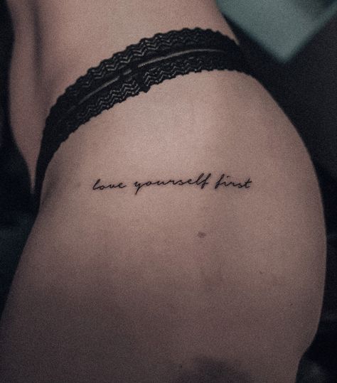 Small hip tattoo with a positive quote. So important to love yourself, because that’s the person you live the rest of your life with. Tattoo Quotes For Women Unique, Words On Hip Tattoo, Tatoos Woman Writing, Beautiful Quotes Tattoo For Women, Tattoo Quotes Thigh, Womens Hip Tattoo Ideas Small, Love Tattoos For Women Words, Writing On Hip Tattoo, Mini Quote Tattoos