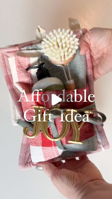 Maria Simonelli on Instagram: "Spread joy with an affordable gift that’s both beautiful and practical 🎁✨. Want to recreate this gift idea? Comment ‘Shop’ to have the details messaged to you or find all the sources in my LTK shop. Create a festive bundle with a beautiful tea towel, cozy potholders, seasonal dish soap, and a handy dish brush. Finish it off with a velvet ribbon and a joyful ornament topper. It’s the perfect way to spread holiday joy! 🌟 #targetstyle @target @targetstyle" Dish Brush, Tea Towel Gift, Beautiful Tea, Christmas Towels, Target Style, Soap Gift, Affordable Gifts, Velvet Ribbon, Dish Towels