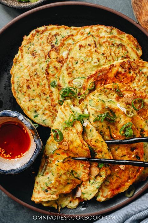 You cannot miss Chinese zucchini pancakes if you love a savory breakfast! Made with simple ingredients, these pancakes are crispy on the outside and tender on the inside. Served with a vinegar sauce and chili oil, you can easily finish half a dozen in one sitting! {Vegetarian} Chinese Zucchini, Asian Pancakes, Chinese Pancakes, Vegetarian Chinese Recipes, Vege Dishes, Zucchini Breakfast, Chinese Breakfast, Asian Breakfast, Vinegar Sauce