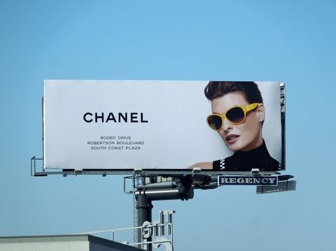 Billboards have the advertisement worded in the correct space. In ... Fashion Billboard, Chanel Yellow, Billboard Advertising, Web Studio, Yellow Sunglasses, Billboard Design, Outdoor Advertising, Signage Design, Fashion Poster