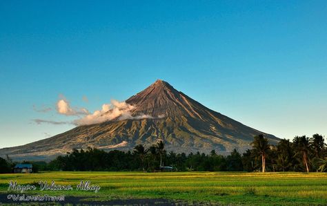 Mayon Volcano, Albay, Philippines Mayon Volcano, also known as Mount Mayon, is an active volcano in the province of Albay, on the island of Luzon in the Philippines. Renowned as the "perfect cone" because of its almost symmetric conical shape, the mountain was declared a national park and a protected landscape on July 20, 1938, the first in the country. It was reclassified a Natural Park and renamed Mayon Volcano Natural Park in the year 2000. Mount Mayon, Volcano Wallpaper, Volcano Pictures, Gymnastics Wallpaper, Mayon Volcano, Beach Wall Collage, Volcano National Park, Ghost Pictures, Active Volcano