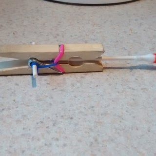 Easiest Ever Kids DIY Mini Crossbow : 8 Steps - Instructables Mini Crossbow, Cross Bow, Clothes Pegs, Diy Cross, My Uncle, Cotton Buds, Kids Diy, Crossbow, Rubber Bands