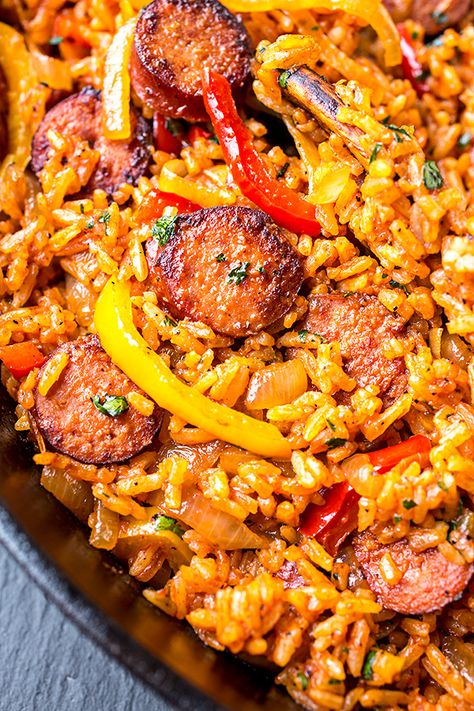 This smoked sausage and red rice skillet is filled with sausage, peppers, and onions, and a hint of tomato—it's the ultimate quick and easy one pan meal! | thecozyapron.com #smokedsausageandredriceskillet #smokedsausage #redrice #skilletmeal #onepanmeal #onepotmeal #ricedish Rice Ideas, Sausage And Rice, Smoked Sausage Recipes, Rice Skillet, Sausage Dishes, Dinner Chicken, Red Rice, Chicken Fried, Smoked Sausage