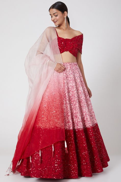 Featuring a red and pink lehenga in raw silk and silk organza base with resham and sequins embroidery. It is paired with a matching blouse and an ombre dupatta.  FIT: Fitted at bust and waist. COMPOSITION: Raw silk, Silk organza. CARE: Dry clean only. Pink And Red Lehenga, Ombre Lehenga, Party Wear Gown, Ombre Dress, Pink Lehenga, Red Lehenga, Embroidered Lehenga, New Address, Dream Wedding Ideas Dresses