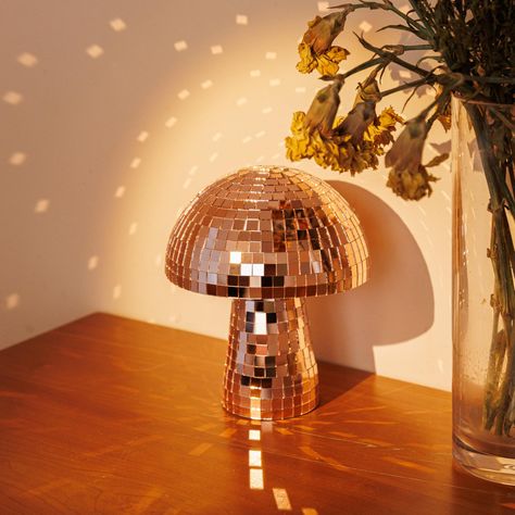 PRICES MAY VARY. Unique Design: Disco ball mushroom's distinctive blend of natural mushroom shape with a dazzling disco ball exterior offers a unique design element that's hard to find elsewhere. Quality Craftsmanship: This mirro ball is made with attention to detail and quality materials, durability and a lasting aesthetic appeal, ensuring that it remains a staple in your decor for years to come. Atmosphere Enhancer: The reflective surface of rose gold ball scatters light beautifully, creating Mushroom Disco Ball, Party Table Decor, Decor Mirror, Ball Lamps, Disco Lights, Rose Gold Mirror, Novelty Lighting, Decorative Sculpture, Light Sculpture