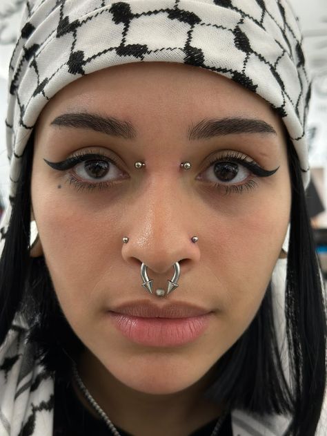 IF YOU'VE EVER THOUGHT ABOUT GETTING A BRIDGE PIERCING, NOW IS THE TIME😉 BRIDGE PIERCING BY @marcymods Soho, Union Square, and Williamsburg 11AM-9PM 7 DAYS A/W🕘 WALK-INZ OR BOOK ONLINE..📕 TATTOOS & PIERCINGS, NO ATTITUDE, NO MISERABLE HOOPS TO JUMP THROUGH....🚫 WALK-INZ WELCOME OR BOOK ONLINE AT ⚔️livebytheswordtattoo.com⚔️ . . . . #bridgepiercing #piercing #bodymodification #facialpiercing #invictusbodyjewelry Triple Bridge Piercing, Double Monroe Piercing, Bridge And Septum Piercing, Bridge Piercing Black Women, Cute Bridge Piercing, Persings Face, Double Bridge Piercing, Bridge Piercing With Glasses, Two Nostril Piercing