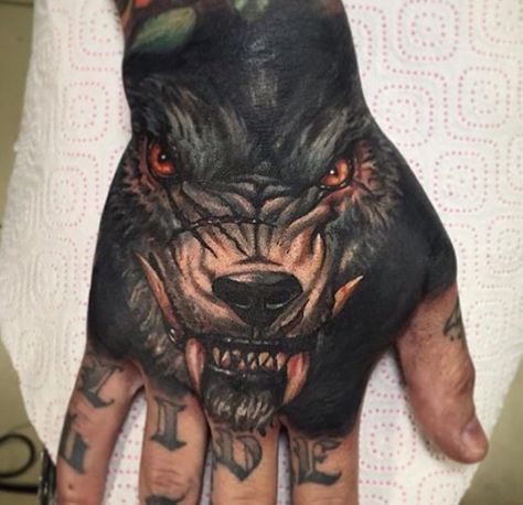 Wolf hand tattoo | Tattoos | Pinterest | Hand tattoos, Wolves and Tattoos  and body art Wolf Hand Tattoo, Tattoo Avant Bras, Tatuaje Cover Up, Cool Wolf, Hands Tattoo, Knuckle Tattoos, Blackout Tattoo, Norse Tattoo, Creepy Tattoos