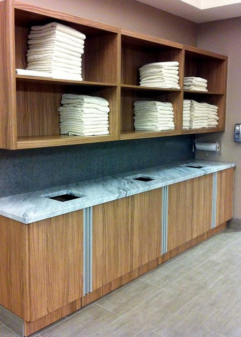 Medical Facility | Towel Drop & Storage Equinox Gym, Laundry Station, Medical Facility, Gym Towel, Bike Store, Spa Towels, Changing Room, Towel Storage, Storage Design