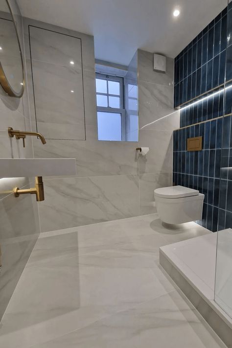 Bathroom Tile Colour Ideas, Feature Tiled Wall Bathroom, White And Blue Marble Bathroom, Blue Gold Marble Bathroom, Bathroom Tiles Color Combination, Subway Tiles Bathroom Ideas, Blue And White Tiles Bathroom, Blue Gold Bathroom Ideas, Polished Tile Bathroom