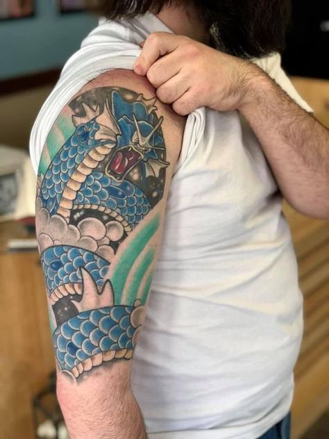 Make your Pokemon tattoo uniquely yours with custom designs. Explore 70+ ideas to capture the essence of this iconic franchise. Gyarados Pokemon Tattoo, Gyrados Pokemon Tattoo, Gyarados Tattoo, Charizard Tattoo, Pokemon Gyarados, Epic Tattoos, Leg Tats, Pokemon Tattoos, Nerdy Tattoos