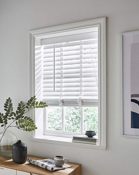 Transform the look of your home with these simple and stylish Wooden Venetian Blinds. Featuring 50mm slats, you can easily turn the pole to adjust the tilt for different times of the day, to allow more or less light into your home. Available in 2 slat sizes and 6 different colours. All fixtures and fittings are included. Tested and safe to the 2014 blind safety standards BS EN 13120. White Wooden Blinds Bedroom, White Blinds For Windows, White Venetian Blinds Living Room, Bedroom Venetian Blinds, Window Blinds Wooden, White Blinds Bedroom, Lounge Blinds Ideas, Home Office Blinds, White Blinds Living Room