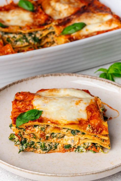 This Spinach Lasagna is a family favorite that will impress! Rich with three cheeses, it's perfect for weeknight dinners or your next gathering Three Cheese Lasagna, Spinach And Ricotta Lasagna, Easy Vegetable Lasagna, Cheese Lasagna, Vegetarian Lasagna, Vegetable Lasagna, Spinach Lasagna, Garden Vegetable, Three Cheese