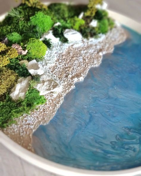 "Nature's Enchanting Beauty from FIPLANTART WORKS: Moss and Ocean Art FrameThis unique frame brings together two wonders of nature, combining moss art with epoxy to bring the depths of the sea and the tranquility of the forest into your home.Product Description Text:This artistic frame brings the enchanting beauties of nature into your home. The large ocean effect created with epoxy is complemented by sea sand and natural rocks. The large forest part, made using ball moss and various types of... Types Of Moss, Wonders Of Nature, Moss Art, Sea Sand, Natural Rock, Green Tones, Ocean Art, Wall Decor Living Room, Urban Art