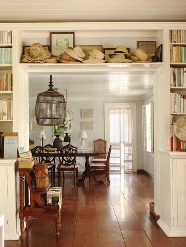 built in bookcases around doorway! Bay Cottage, British Colonial Decor, Warm Color Schemes, British Colonial Style, Traditional Dining Room, Colonial Decor, Beach Bungalows, Decoration Inspiration, Colonial Style