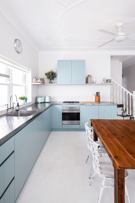 Light Wood Beadboard Panels with Gray Countertops
The warm tones of the light wood beadboard cabinetry provide a rustic yet cozy vibe for this beach cottage kitchen. Cabinets With Gray Countertops, Beachy Backsplash, Kitchen Ideas Coastal, Coastal Backsplash, Wood Beadboard, Coastal Inspired Kitchens, Gray Countertops, Beach Cottage Kitchen, Beach Style Kitchen