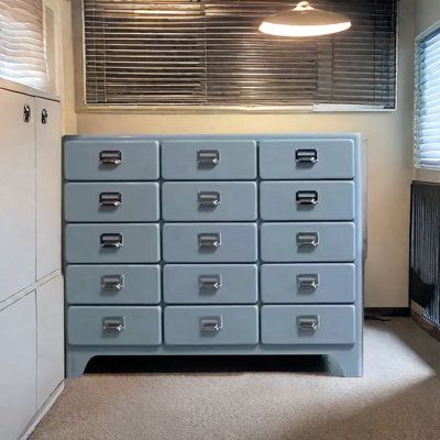 This Vintage Japanese-Style Metal Sideboard captures the essence of retro aesthetics with its neat array of drawers and classic metal handles. Perfect as a dining sideboard or an organizer, it offers multiple drawers to keep your space tidy and clutter-free. The clean lines and orderly arrangement reflect the minimalist beauty of Japanese design, while the durable metal construction ensures it's built to last. | Hokku Designs Runo 45.27" Sideboard Blue 37.79 x 45.27 x 15.74 in, Metal | C11108296 Dresser Vintage, Metal Sideboard, Blue Sideboards, Dining Sideboard, Apartment Stuff, Sideboard Grey, Japanese Interior Design, Minimalist Beauty, Small Space Kitchen