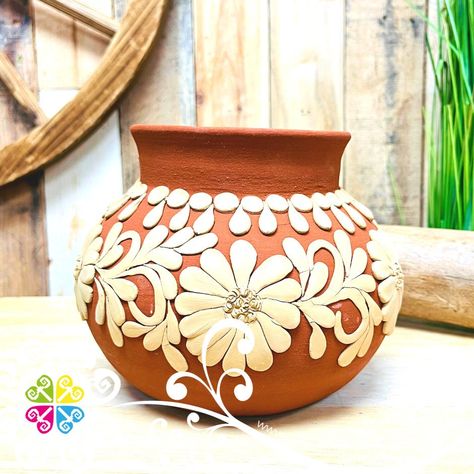 Bring the color of Mexico's culture to your home or office with this original piece. Carefully curated by Artisan  Paty Gaytan from Santa Maria Atzompa, Oaxaca. Each flower is handcrafted and placed with care and passion to create beautiful patterns.  The base (ollita) is made with red clay with a coat of seal inside. The flower designs (bordado) are made with natural clay or "pastillaje".  You will love every detail of this amazing piece. Use it as a centerpiece alone or to put flowers inside! Mexican Pottery Designs, Mexican Bedroom Decor, Clay Flower Vase, Mexican Bedroom, Mexican Christmas Decorations, Ceramics Pottery Vase, Mexico Culture, Talavera Pottery, Natural Clay