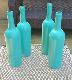 painted wine bottles Spray Painted Wine Bottles, Reuse Wine Bottles, Halloween Wine Bottles, Wine Bottle Crafts Christmas, Blue Wine Bottles, Artsy Crafts, Wine Bottle Centerpieces, Wine Bottle Design, Bottle Centerpieces