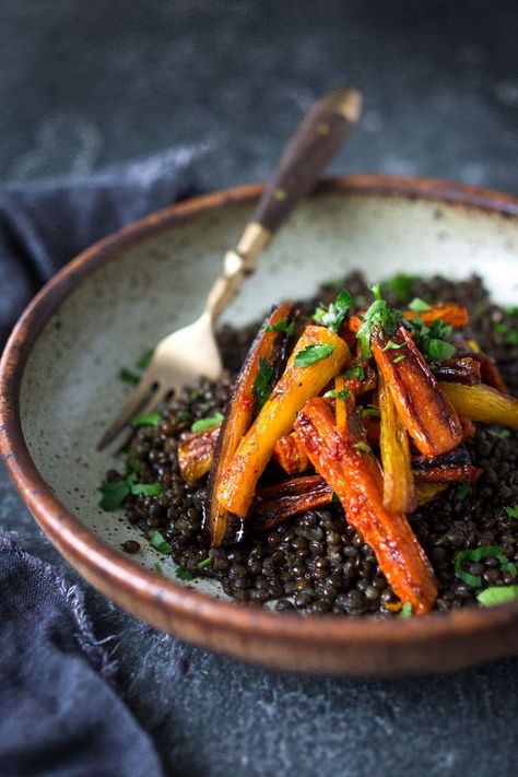 A simple tasty recipe for Roasted Moroccan Carrots- with cumin cinnamon and orange. Serve as a side or over seasoned lentils for a hearty vegetarian meal. | http://www.feastingathome.com Vegetarian Recipes Grill, Cook Carrots, Casserole Vegetarian, Moroccan Carrots, Vegetarian Bowls, Black Lentils, Vegan Side Dishes, Vegan Sides, Vegetarian Meal