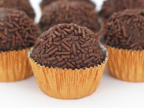 Brigadeiro    Ingredients    3 tablespoons unsweetened cocoa  1 tablespoon butter  1 (14 ounce) can sweetened condensed milk    Directions    In a medium saucepan over medium heat, combine cocoa, butter and condensed milk. Cook, stirring, until thickened, about 10 minutes. Remove from heat and let rest until cool enough to handle. Form into small balls and eat at once or chill until serving. Chocolate Brigadeiro Recipe, Brazilian Candy, Brigadeiro Recipe, Brazilian Chocolate, Brazilian Desserts, Brazilian Dishes, American Desserts, Truffle Recipe, Brazilian Food