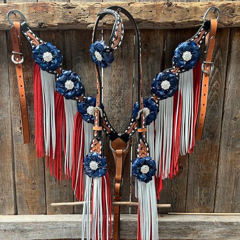 Browband, one ear and breastcollar is classic style. They are decorated with bright silver Clear crystal conchos, blue gardenias and red/white leather fringe. Full Horse size Measurements Headstall measurements : bit to bit - 36" shortest setting : 44" longest settingBrowband measures 15" acrossBreastcollar measurements - From Center Ring to D Ring -16"Breastcollar including toggles : shortest settings - 26" : Longest settings -29" Lifetime guarantee on all crystals. Buy Together or Separate BROWBAND ONLY - $314.00 ONE EAR ONLY - $246.00 BREASTCOLLAR ONLY - $491.00 BROWBAND TACK SET -$805.00 ONE EAR TACK SET - $737.00 23269 - 232701 - 5701 Red White And Blue Horse Tack, Teal Horse Tack, Horse Tack Sets, Horse Stall Decorations, Western Horse Tack Turquoise, Western Riding Tack, Bling Tack Sets, Rodeo Fits, Freebies On Your Birthday