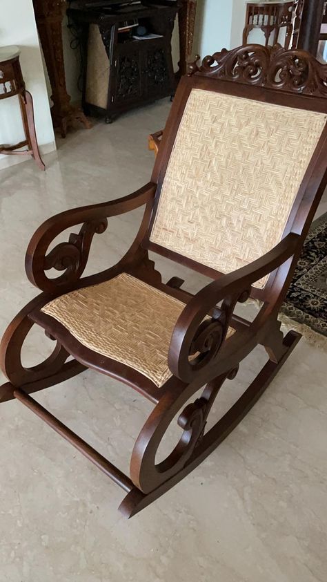 Relax in timeless comfort with Heritage Art and Architecture's Wood and Cane Rocking Chair! 🪑 Crafted with a perfect blend of traditional charm and contemporary comfort, this rocking chair is a testament to classic craftsmanship. Made with high-quality wood and intricately woven cane, it promises not only style but also durability and ease. Perfect for lazy afternoons or cozy evenings, this chair adds a touch of elegance to any corner of your home. Cane Rocking Chair, Carved Dining Chairs, Heritage Art, Bergere Chair, Armless Chair, Easy Chair, Wooden Chair, Swivel Chair, Modern Chairs