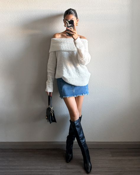 This Sydney Sweater is the one you grab when you want to look cute on a warm Autumn day. This lightweight pullover sweater features an off the shoulder neckline and a loose fit. Style it with a denim mini skirt and boots for the perfect Autumn 'fit! More Details: - Fits true to size for most - Does stretch - Pullover sweater - Slight oversized fit - Full length/not cropped - 100% acrylic - Color: Ivory - Color may vary due to the lighting - Model is wearing a size small styled with the Seren Den Sweater And Mini Skirt Outfit Fall, Chunky Sweater Mini Skirt Outfit, Sweater Over The Shoulder Outfit, Sweater Skirt Boots Outfit, Sweater And Jean Skirt, Off The Shoulder Top Outfit Winter, Oversized Sweater Skirt Outfit, Skirt With Knit Sweater, Winter White Skirt Outfit