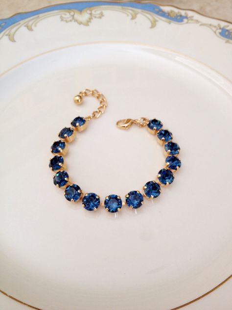 Bracelet featuring sparkling 8mm navy blue crystals.  I love this rich, navy blue! Gold plated setting, as pictured, also available in silver plated, bronze, antique silver or rose gold plated.  Please make your metal selection from the drop down menu at check out. Adjustable between 6 1/2 and 8 1/2 inches in length.   Thanks for stopping by! Navy Blue Bracelet, Dark Blue Accessories, Dark Blue Bracelet, Dark Blue Jewelry, Navy Blue Jewelry, Blue Crystal Bracelet, Something Blue Bridal, Crystal Teardrop Earrings, Bracelet Tennis