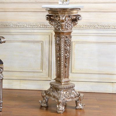 Introducing the stunning standing pedestal with a sleek silver finish and exquisite inlay work! Elevate your space with this elegant and eye-catching piece that exudes sophistication and luxury. Its intricate design and meticulous craftsmanship will leave you and your guests in awe, making it a beautiful addition to any room. Whether you want to showcase your favorite sculpture, display your cherished family photo, or simply add a touch of glamour to your decor, this standing pedestal is the per Sculpture Display, Winged Lion, Silver Plant, Victorian Interiors, Telephone Table, Don't Settle, Marble Granite, Iron Decor, Exotic Flowers