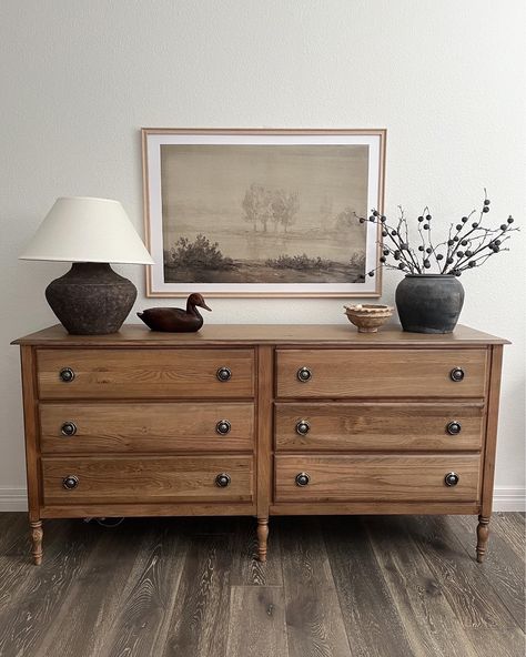 We have lived here for 3 years and I've never been able to style this dresser in a way that I liked it. I finally LOVE how it looks. Dresser styling idea Follow my shop @katewinfordhome on the @shop.LTK app to shop this post and get my exclusive app-only content! #liketkit #LTKstyletip #LTKhome #LTKsalealert @shop.ltk https://liketk.it/4KlYZ Refurbish Old Dresser, Minimalist Dresser Styling, Wall Above Dresser Decor, Dresser Decor Under Tv, Dresser Display Ideas, 2 Dressers In Bedroom, Tv In Bedroom Ideas On Dresser, On Top Of Dresser Decor, Double Dresser In Bedroom