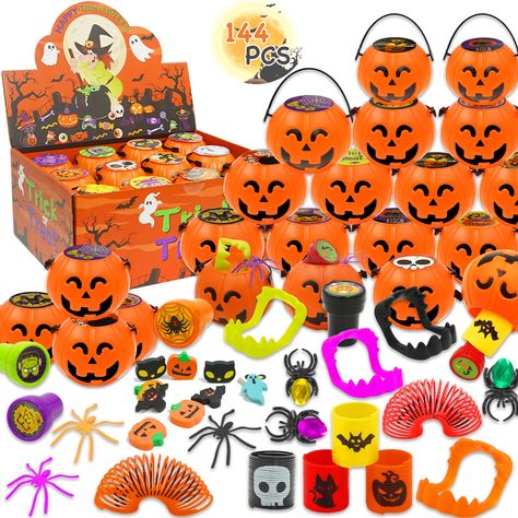 PRICES MAY VARY. 🎃【Super Value Halloween Party Favors】 18 Pack Prefilled Halloween Toys totaling 144 fun pieces!Each Pumpkins bucket holds 18 surprise springs, 18 jewel spider rings, 18 creepy spiders, 18 fun erasers, 18 colorful stamps, 18 spooky false teeth, and 18 Halloween stickers.These are perfect for filling Halloween goodie bags and adding an extra layer of surprise to your festivities. 🎃【Prefilled Halloween Pumpkin Boxes】This all-in-one party favor set comes fully prepared, so you don’t have to worry about assembling different Halloween toys for kids. Simply open the box, and everything is ready to go! The eye-catching pumpkin box will immediately capture kids' attention, sparking their curiosity to discover the Halloween toys hidden inside. Each box holds a delightful surprise Class Halloween Goody Bags, Halloween Goodie Bags For Kids School, Fun Erasers, Halloween Party Prizes, Halloween Party Favors For Kids, Halloween Party School, Halloween Party Gift Bags, Spider Rings, Halloween Prizes