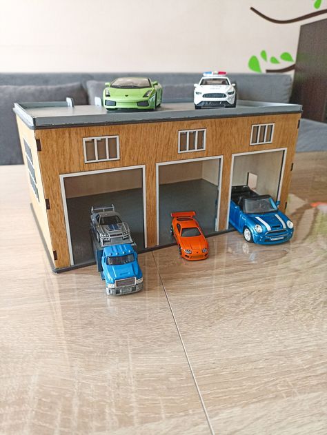 Give your little ones the ultimate playtime experience with this amazing 3 car garage, complete with a specially designed ramp for their toy cars! Crafted with meticulous attention to detail, this playful and practical gift is guaranteed to bring endless hours of joy.  Let your little ones explore their love for cars and ignite their creativity with our amazing toy garage. Materials: Our 3 car garage is expertly constructed using sturdy and child-safe materials, ensuring maximum durability. It i Wooden Toy Garage, Toy Car Garage, Dramatic Play Preschool, Toy Garage, 3 Car Garage, Spiderman Birthday, Toy Cars, Fire Station, Building Construction